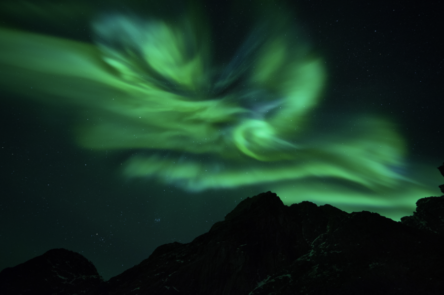 Northern lights Aurora borealis with mountains in Greenland by Virgil Reglioni